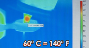 An infrared camera shows iron particles heating a tumor to liquefication, while adjacent healthy tissue stays cool and unharmed.